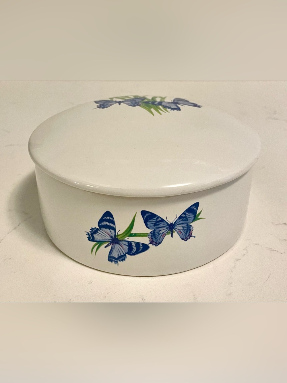 Vintage FTD white porcelain round trinket jewelry box featuring blue butterflies